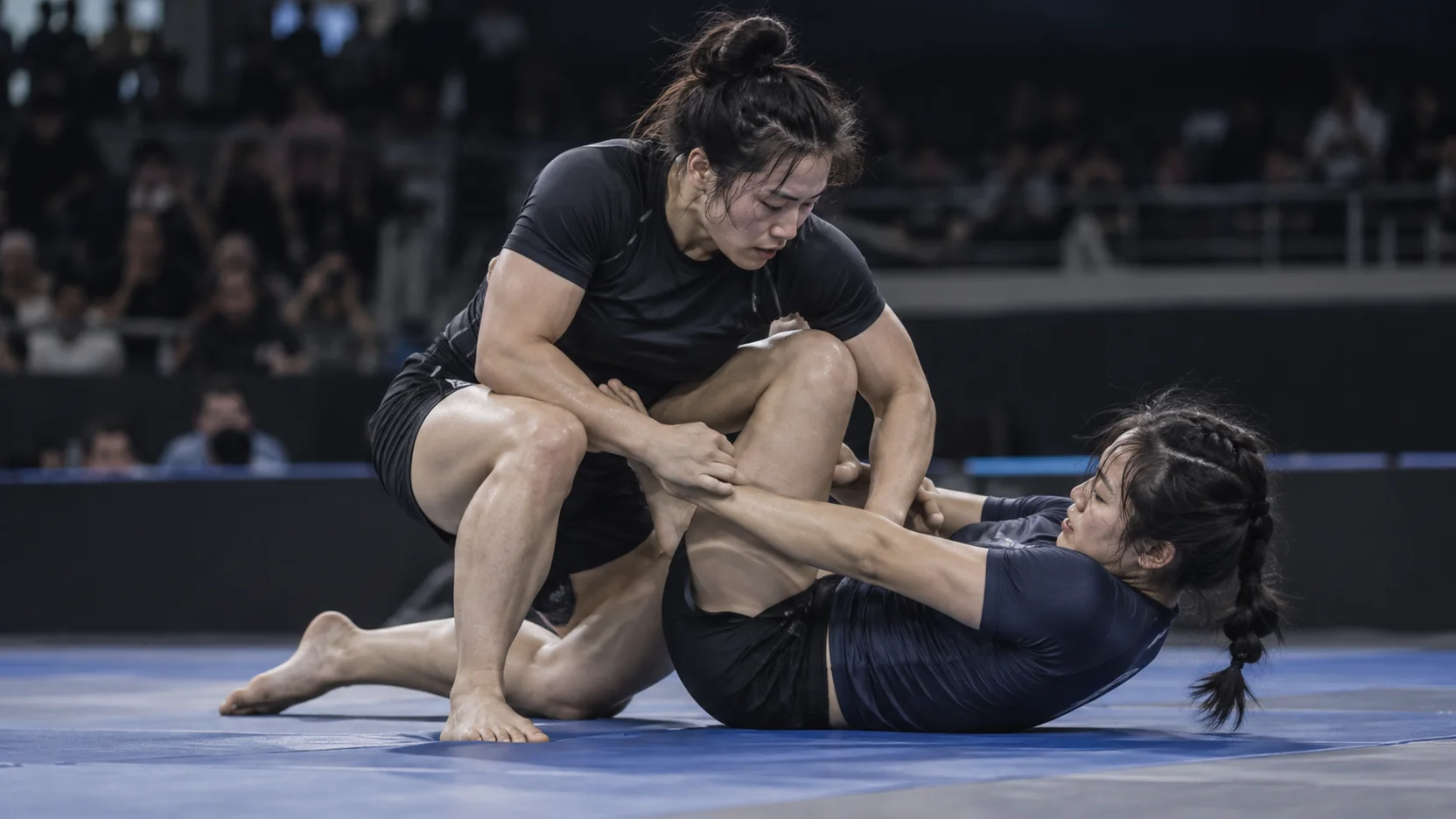Jiu-jitsu athletes working for position on the mat.